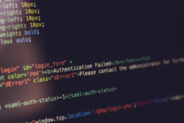 Close view of computer screen displaying HTML code with an authentication error.